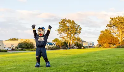 Monte Rey On CSUMB with hands up