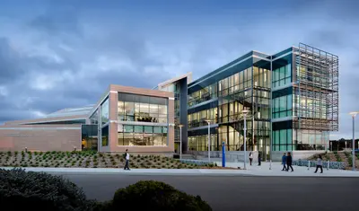 Bit building with expansive glass design, reflecting innovation and a dynamic learning environment.