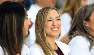 MSPA student smiling during the White Coat Ceremony