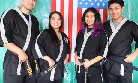 Four members of the martial arts Vanderlipe family, whose Salinas business was helped by CSUMB students