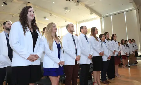 Students in the Master of Science Physician Assistant (MSPA) Program at CSUMB, shown here at their first White Coat Ceremony in December 2019, have joined hospital volunteer corps all over the country to help battle COVID-19.