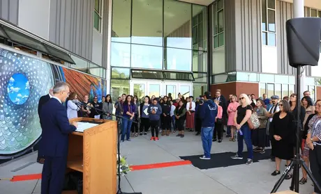 President Eduardo M. Ochoa addresses the crowd gathered outside the new CAHSS building for a ribbon cutting ceremony in October 2019.