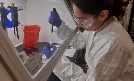 CSUMB science student Angela Albanese volunteers in the Monterey County Health Department lab to help test for COVID-19.