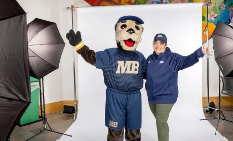 President Quinones posing with Monte Rey