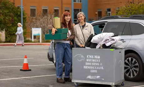 A student and their mom at Move-In Day 2023 - by Brent Dundore-Arias