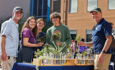 Professor Fred Watson, right, discusses environmental science with visitors at CSUMB's annual Open House.