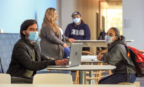 A photo of CSUMB students studying