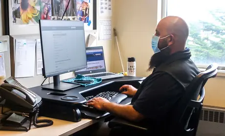 Bobby Quinonez working at his desk