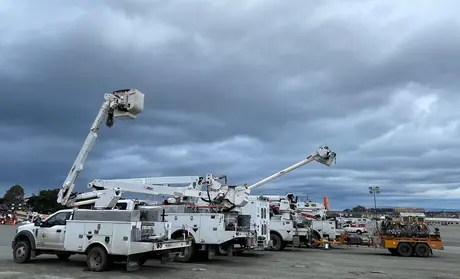 Bucket lift trucks on a CSUMB lot
