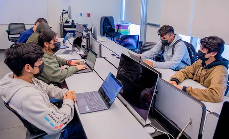 Photo: A group of CTI students on their laptops