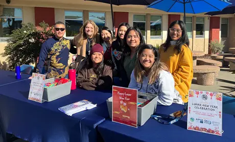 President Vanya Quiñones and members of Asian Pacific Islander Affinity group outside the Campus Dining Commons