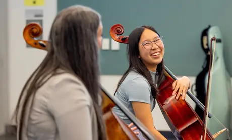 Cellist Averie Huang (right), 18, of Santa Cruz, gets tips on her playing from  Ameena Maria Khawaja during a California Orchestra Academy workshop