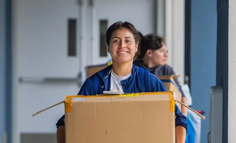 A student moving in to campus housing | By Brent Dundore-Arias