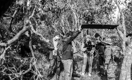 Cristian Vega and crew members work on his film, 