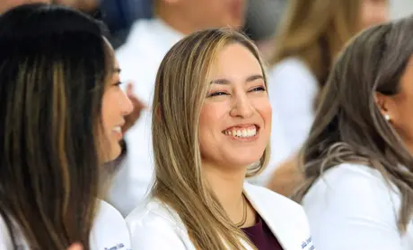 MSPA student smiling during the White Coat Ceremony