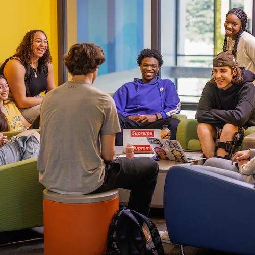 Students sitting in the lounge conversing