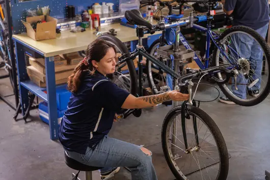 Employee working on a bike.