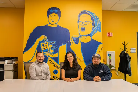 OC3 members sitting at a table in the OC3