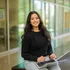 A student sitting with their laptop in the business and information technology building