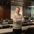 A business administration student smiling at the camera