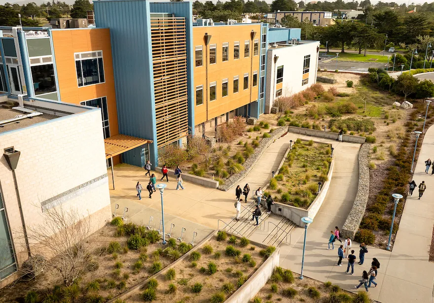 Aerial drone photo of students walking on the Cal State Monterey Bay campus.