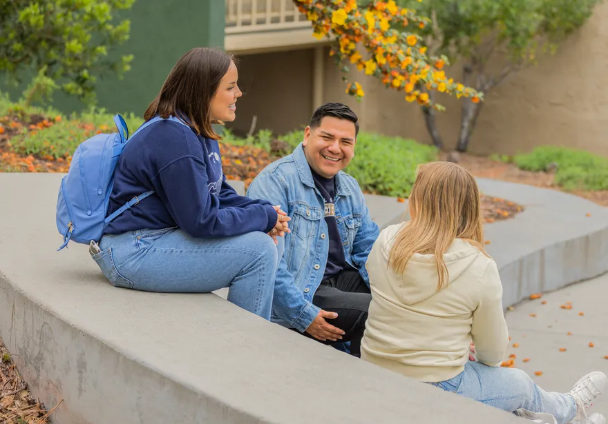 Students chatting together outside