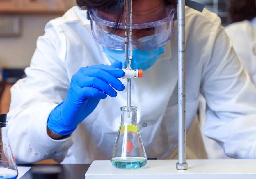 A student conducting a chemistry experiment
