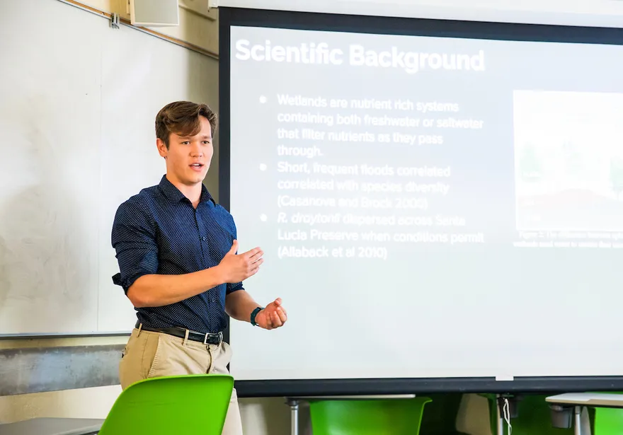 Student giving a scientific presentation
