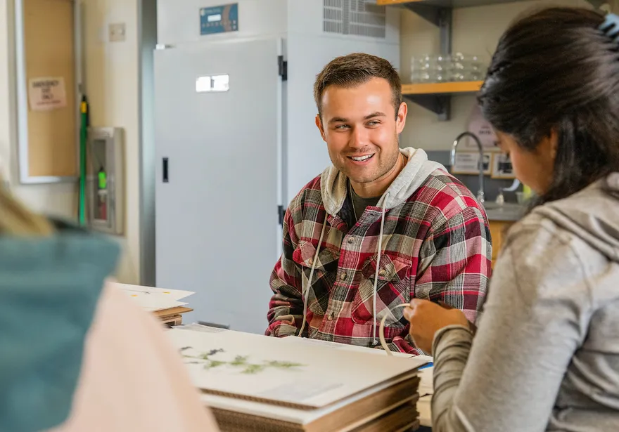students sitting at a table in a lab