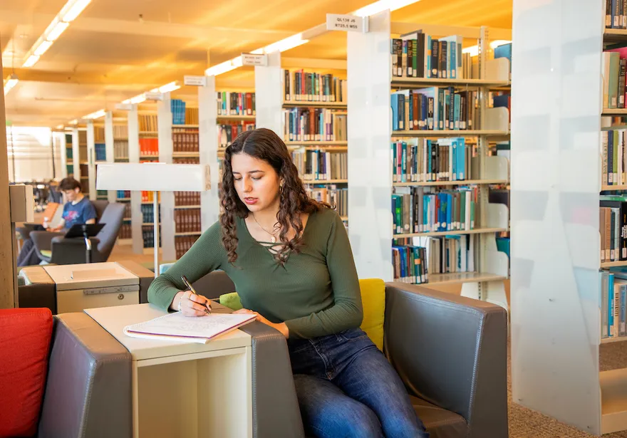 A student studying in the library