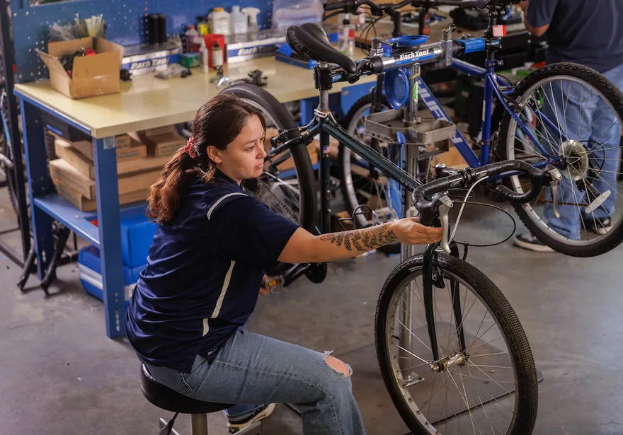Employee working on a bike.