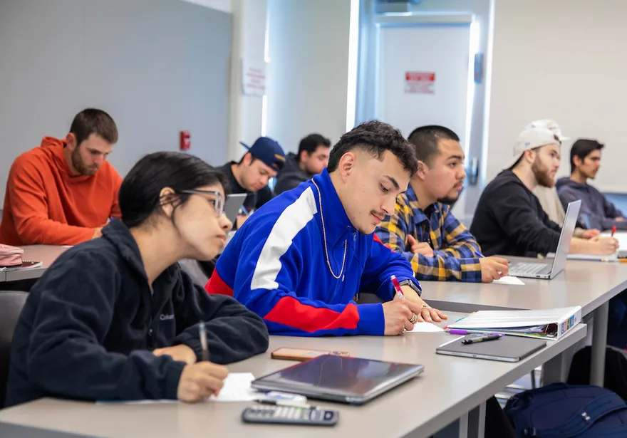 Students in class writing
