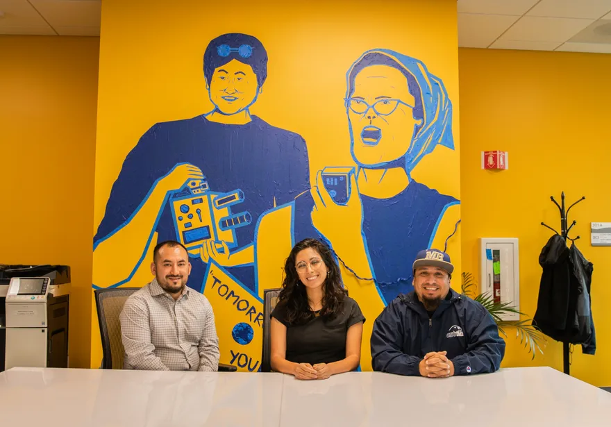 OC3 members sitting at a table in the OC3