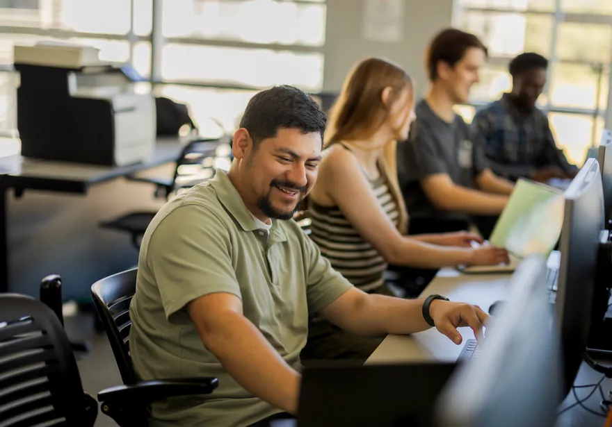 A group of students working in the business and information technology building
