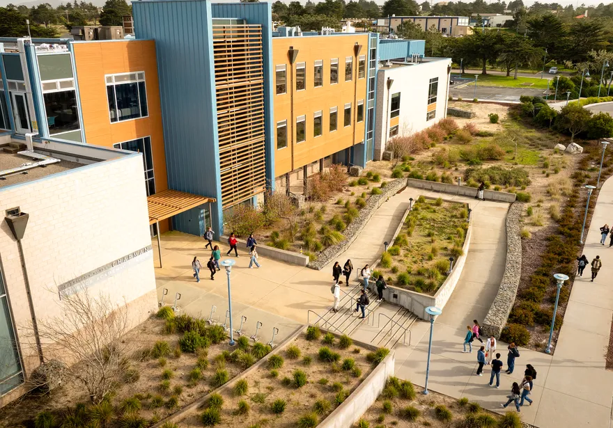 Aerial drone photo of students walking on the Cal State Monterey Bay campus.