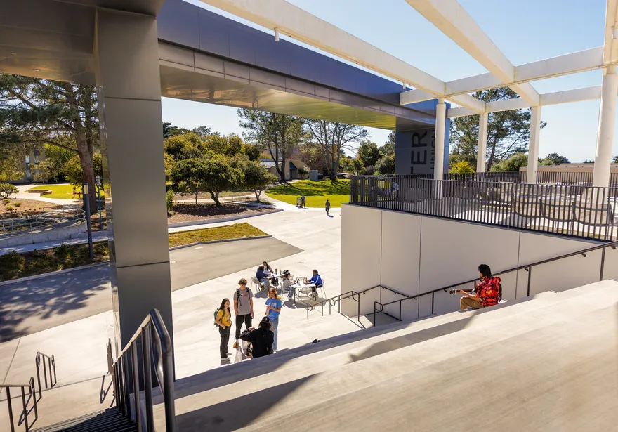 Students gathered on steps outside a building