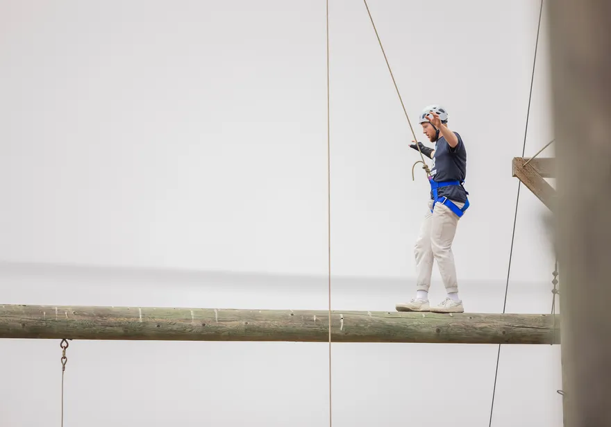 Student walking the high rope