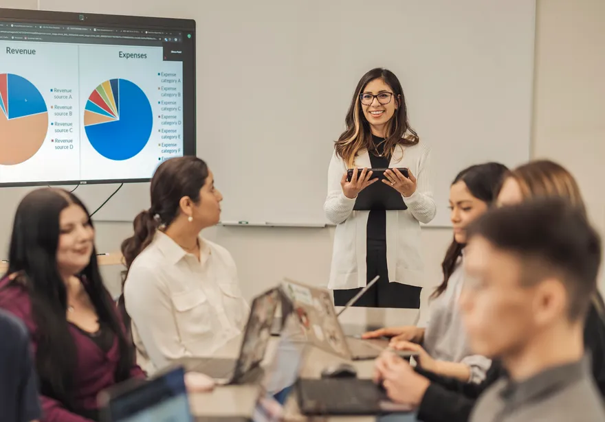 An accounting professor presents to a class