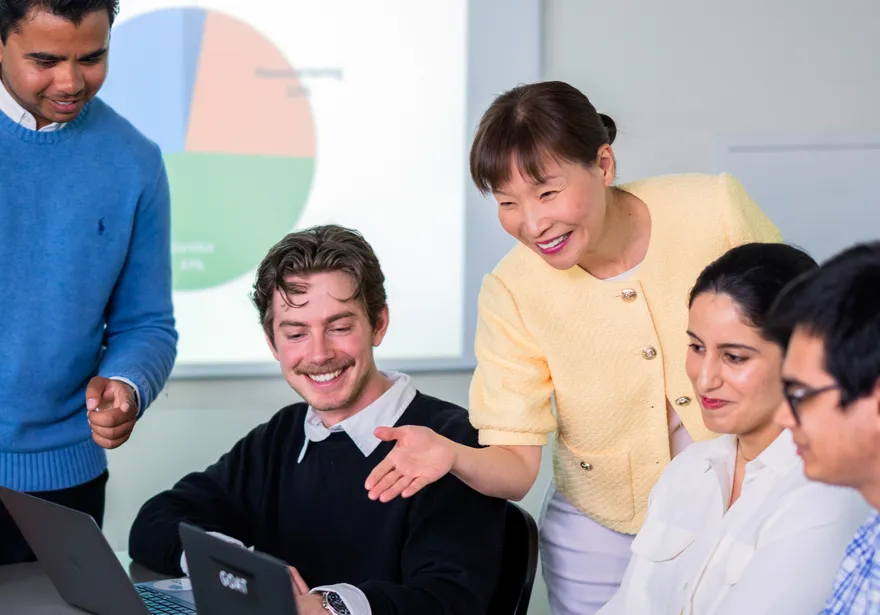 An accounting professor overlooks a classroom of accounting students