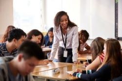 Instructor working with students.